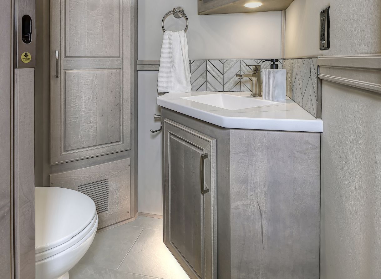 Cabinet, vanity, and toilet in the 2026 Verona LE