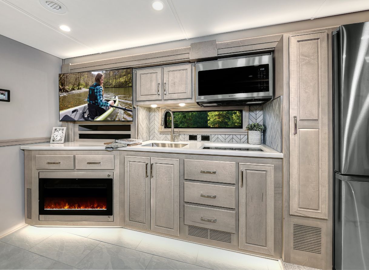 Several cabinets and a microwave in the 2026 Verona LE&#039;s kitchen