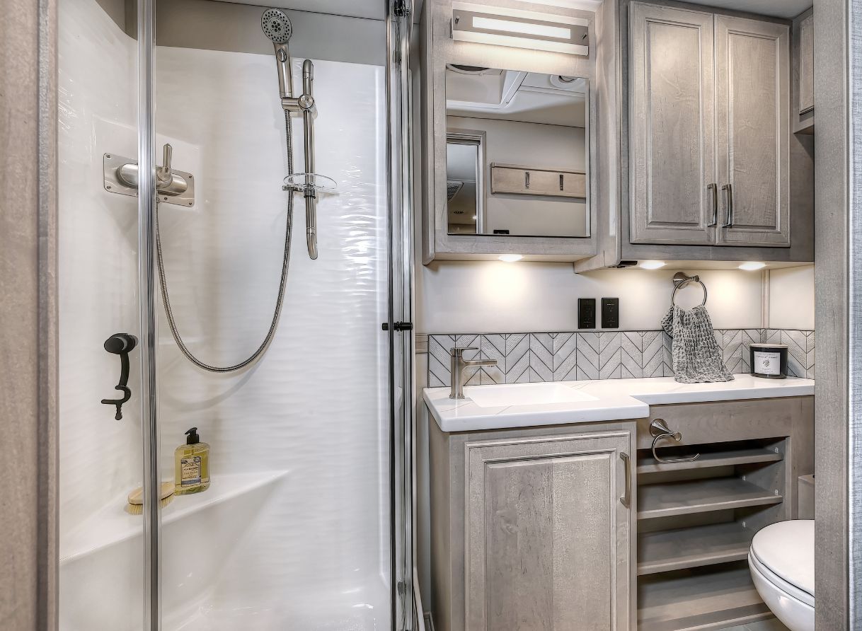 Shower, cabinets, mirror, and vanity in the 2026 Verona LE&#039;s bathroom