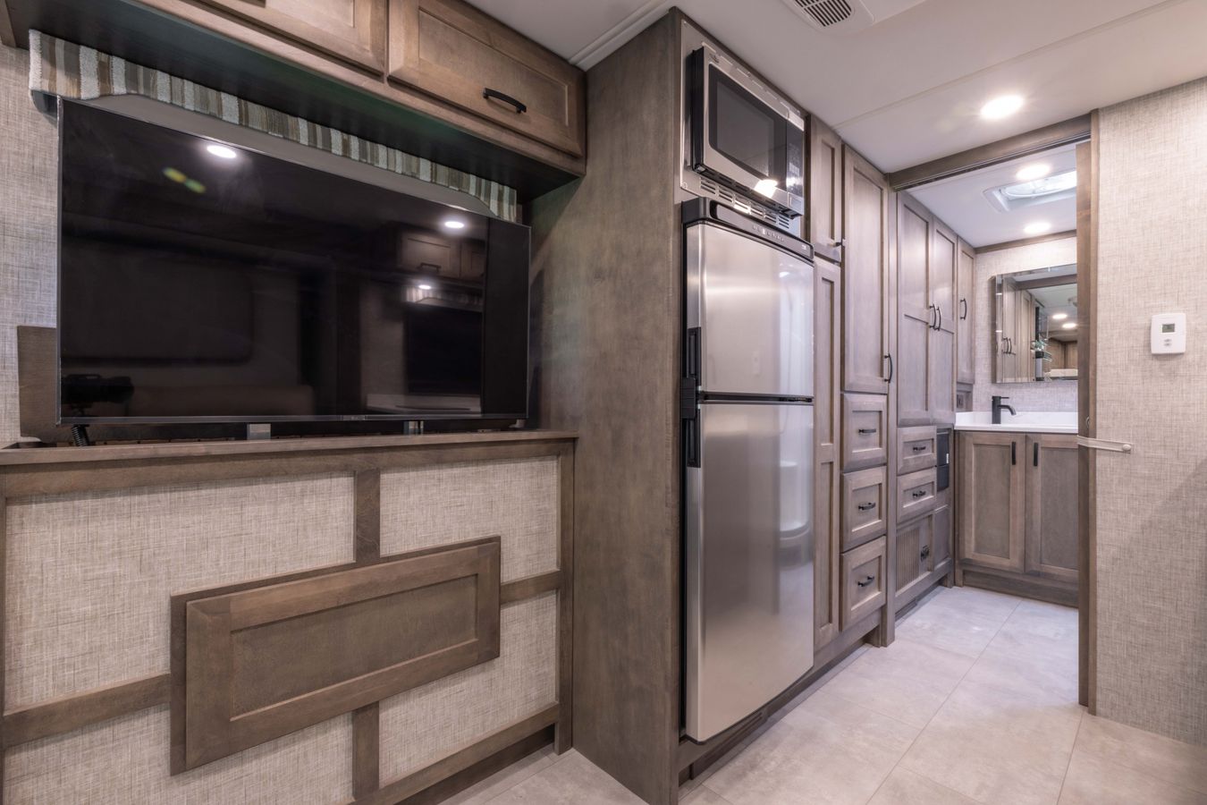 TV, Fridge, and cabinets in the Tiffin Midas