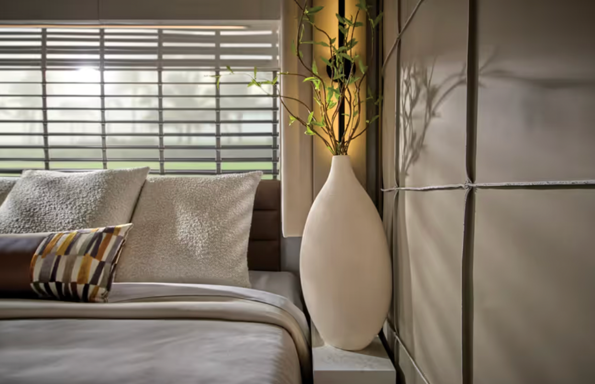 Bed and nightstand in the 2026 Newmar King Aire