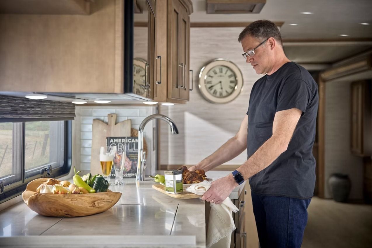 Man at kitchen sink