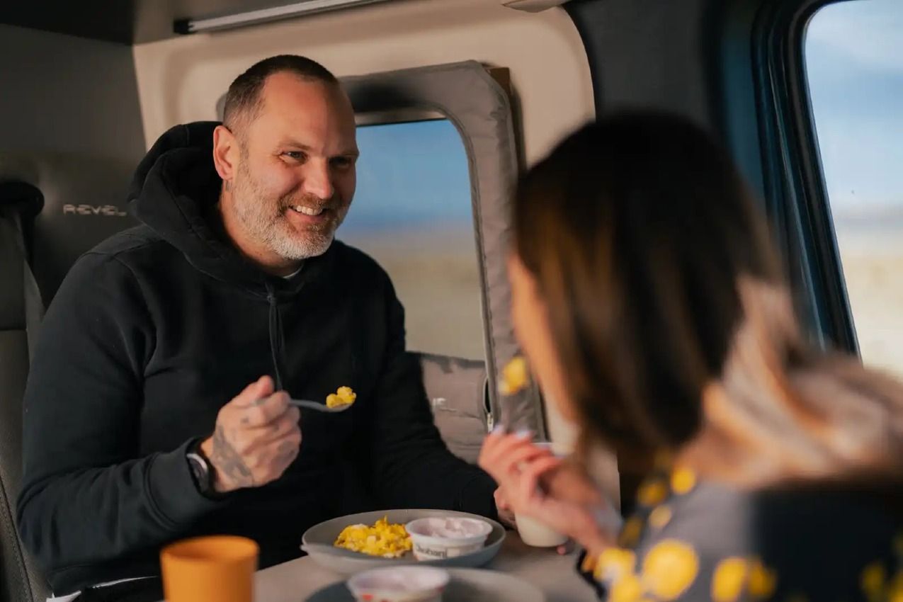 Couple eating inside an RV