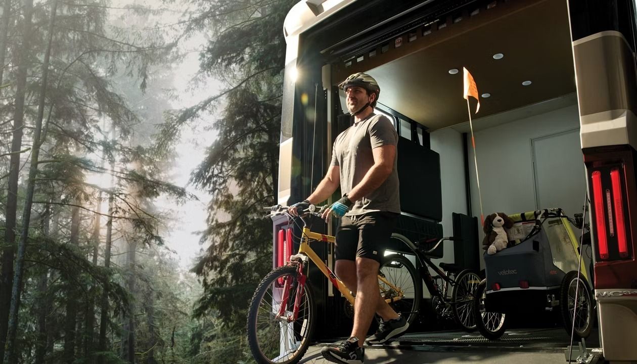 2027 Newmar Canyon Star garage with a person on a bike