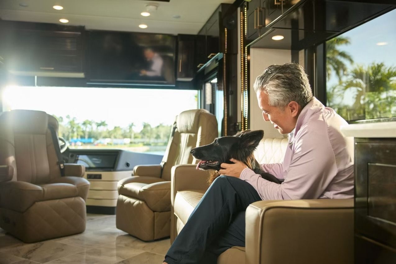 2027 Newmar Essex interior with a person sitting in a chair
