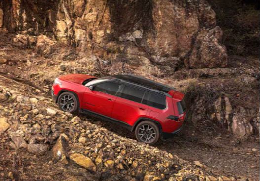 2026 Jeep Cherokee Limited 4x4 climbing a rocky off-road trail