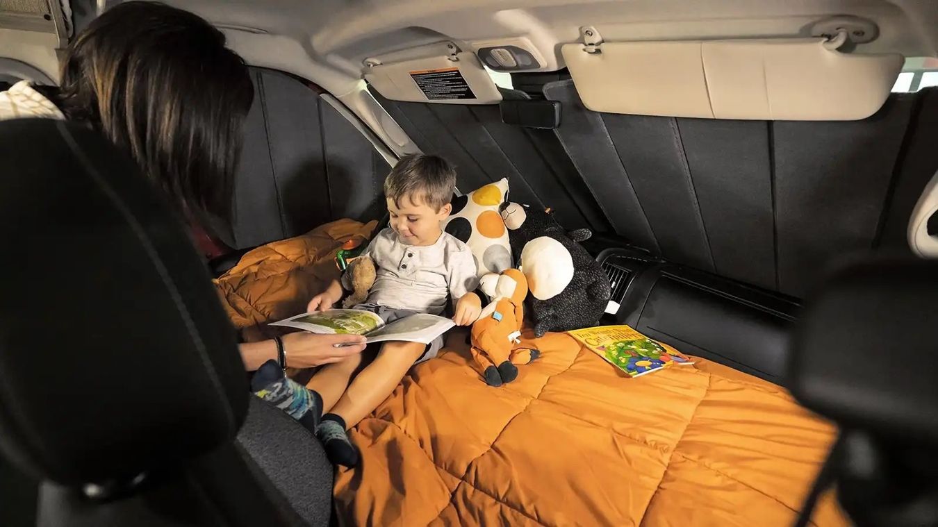 Woman and child inside an RV
