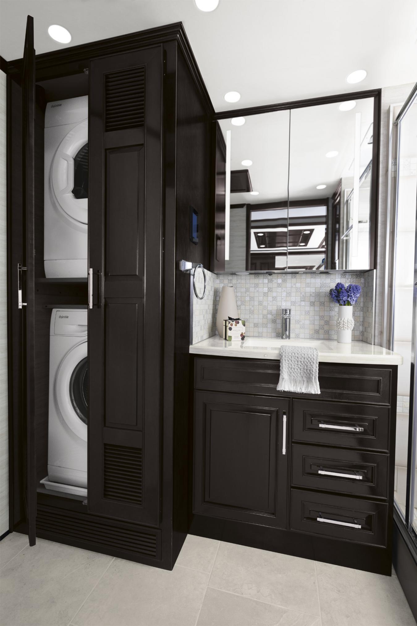 Laundry and bathroom sink inside the 2024 Newmar Supreme Aire