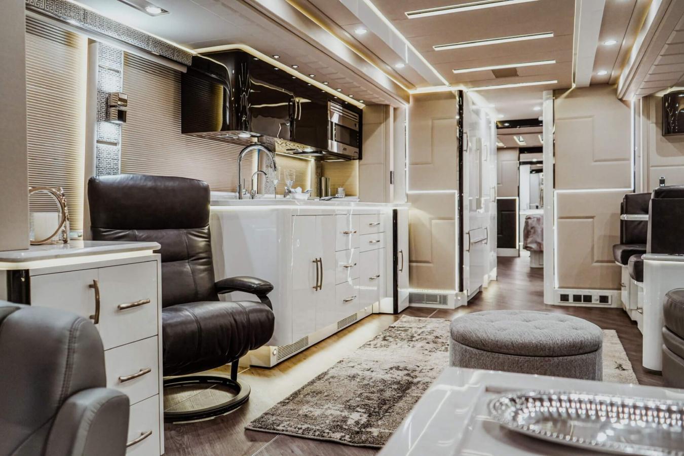 An interior shot of an Emerald Luxury Coach RV with white cabinets