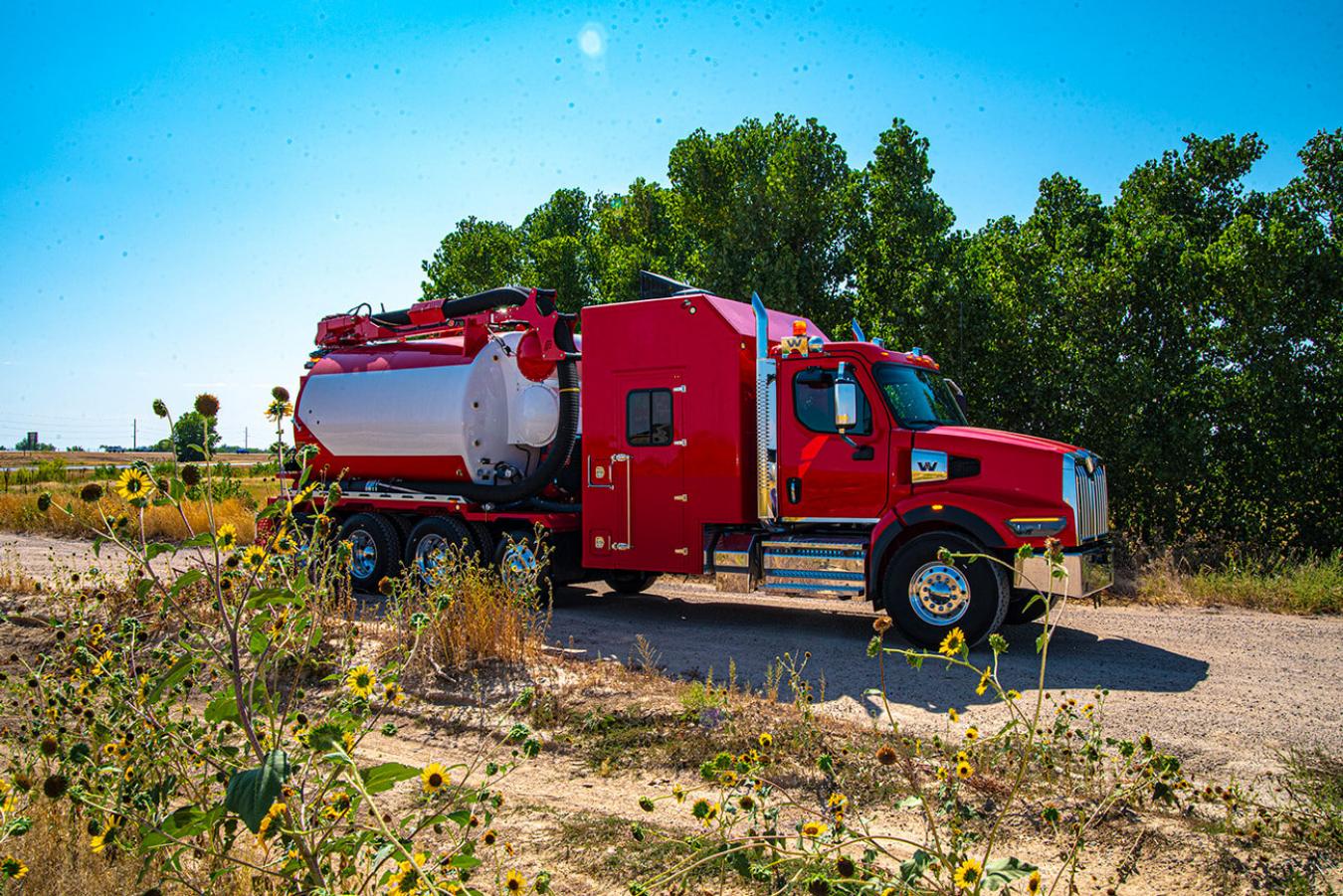Red and white Formeost hydrovac truck