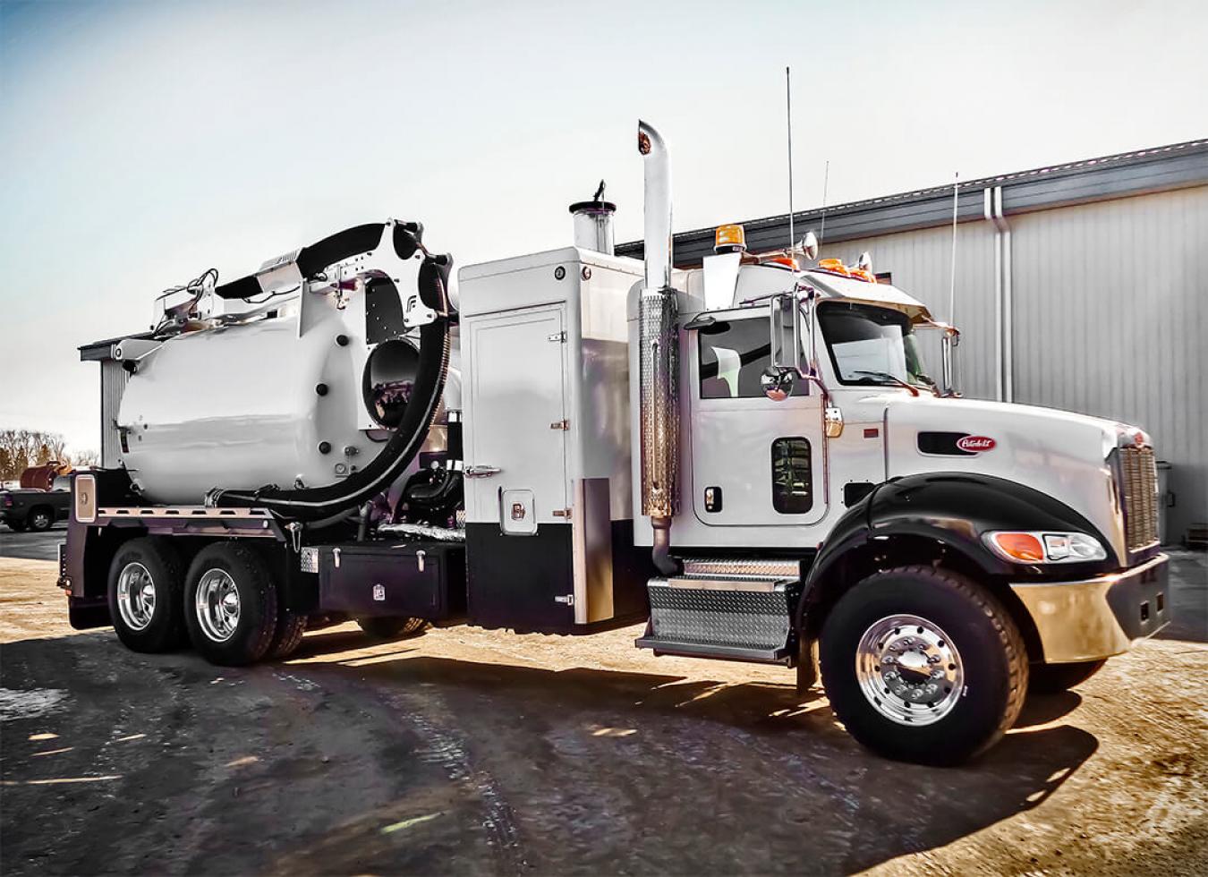 White and black Foremost hydrovac truck