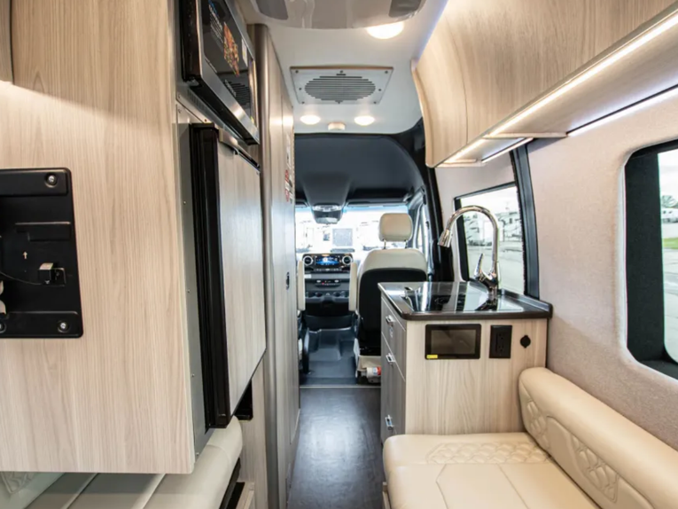 Interior hallway shot of the 2025 Tiffin GT1 from the back, looking toward the cockpit 