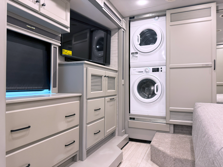 Cabinets, washer, and dryer in the Tiffin Allegro RED