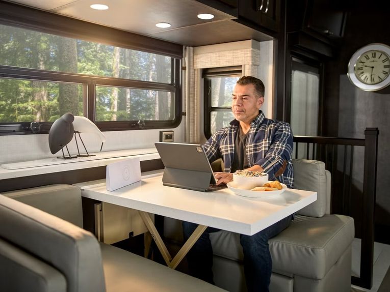 Person sitting at a table inside the 2027 Newmar Super Star