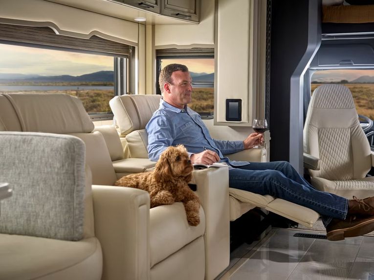 Man and dog inside an RV