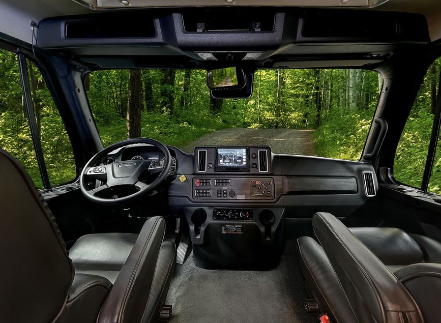 2026 Renegade Verona cockpit with touchscreen controls, leather captain chairs, and wide front view.