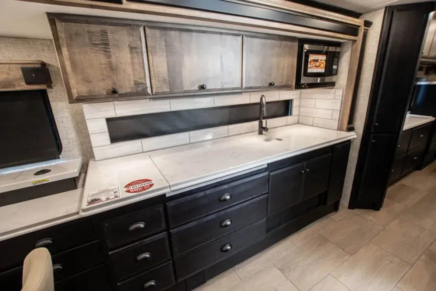 Kitchen cabinets and sink in the 2026 Tiffin Allegro Breeze