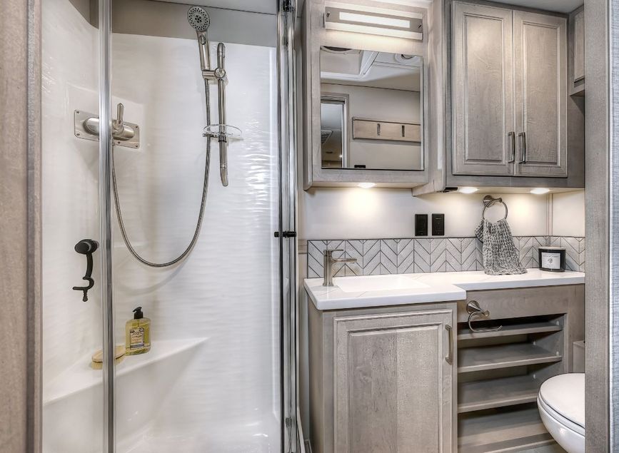 Shower, cabinets, mirror, and vanity in the 2026 Verona LE&#039;s bathroom