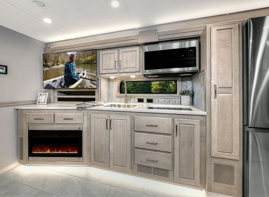 Several cabinets and a microwave in the 2026 Verona LE&#039;s kitchen