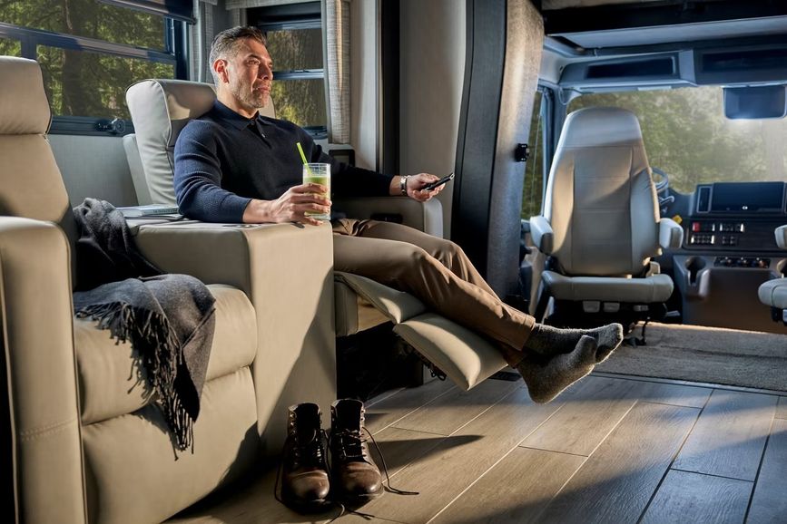 Person sitting down in a chair inside the 2027 Newmar Super Star 