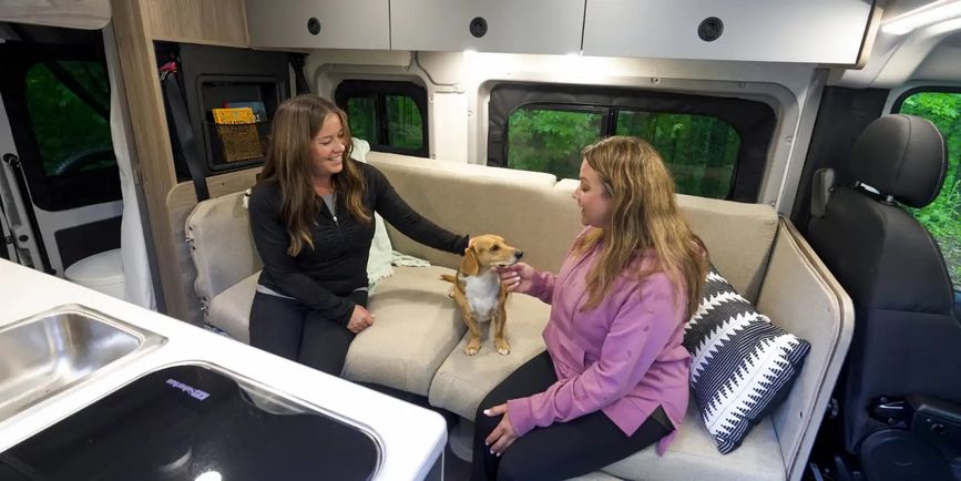 Two women and a dog inside the Solis Pocket