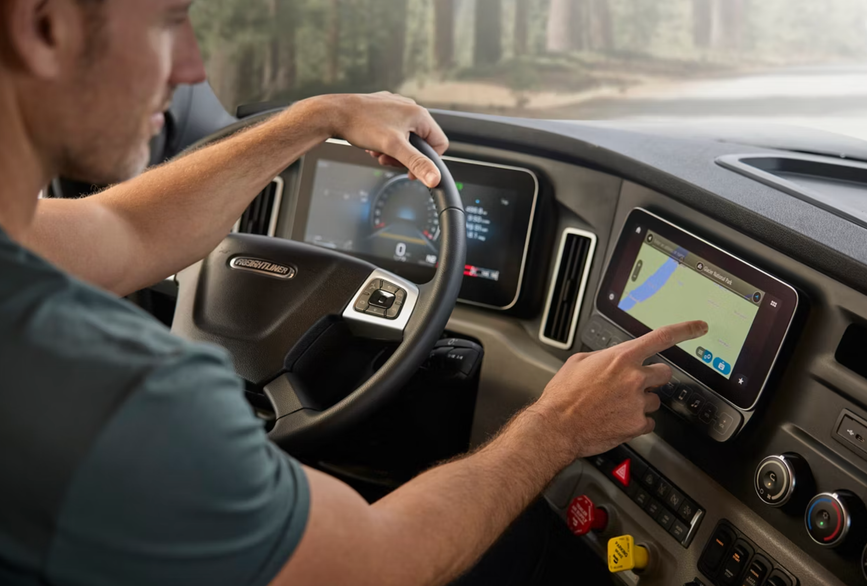 A man in the 2026 Newmar Summit Aire cockpit