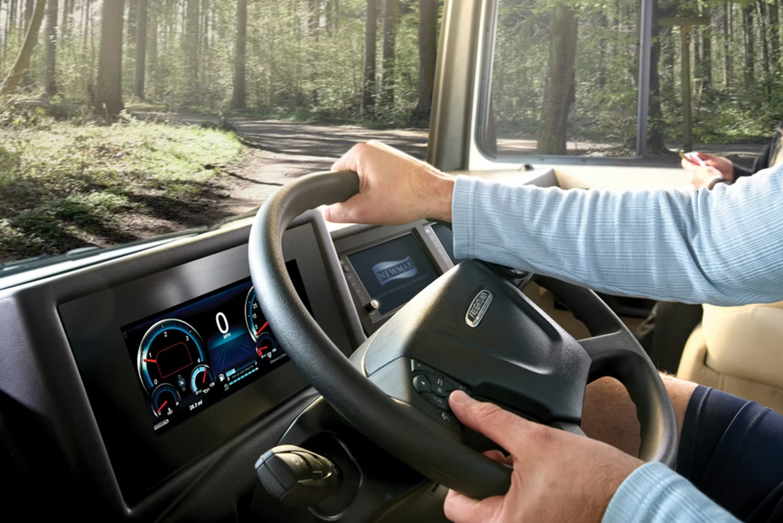 Someone grips the steering wheel in a Canyon Star