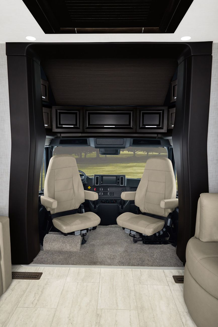 View of the dashboard, drivers seat, and passenger&#039;s seat aboard the Super Star