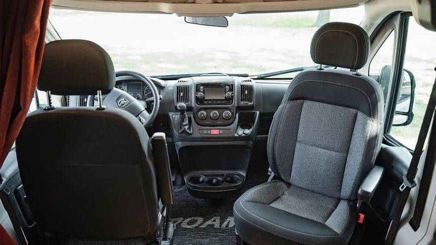Driver and passenger seat inside the Winnebago Roam