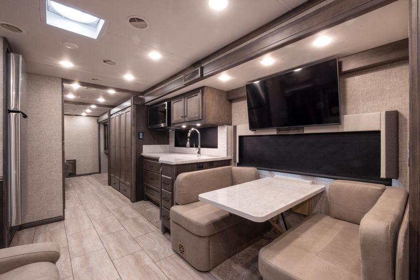 Galley and dinette inside the Open Road Allegro