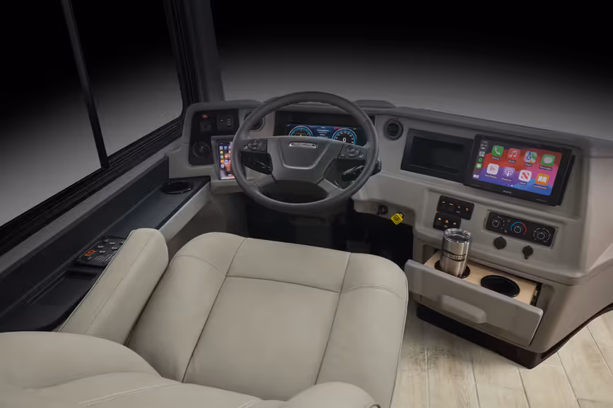 The Northern Star&#039;s cockpit with steering wheel, comfortable seat, and large screen