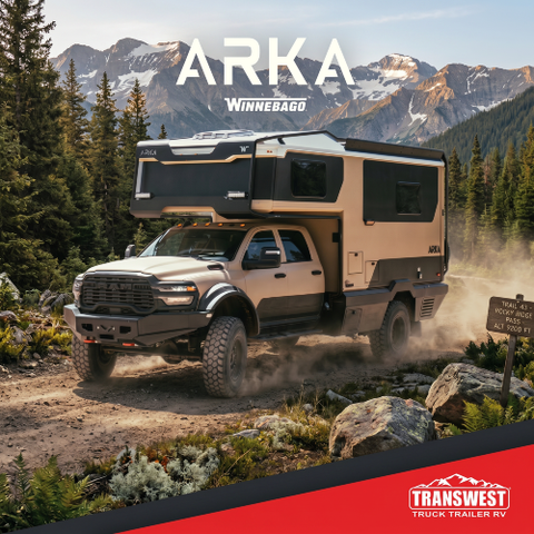 2027 Winnebago Arka driving through the mountains on a dirt road
