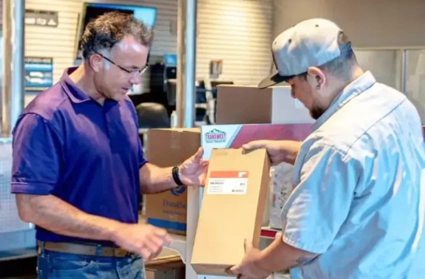 Two men check a package inside a store