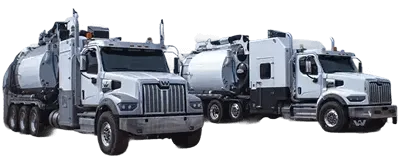 Two hydrovac trucks side by side