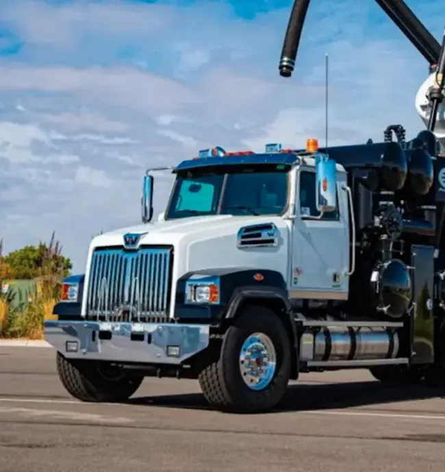 A hydrovac truck sitting stationary in a parking lot