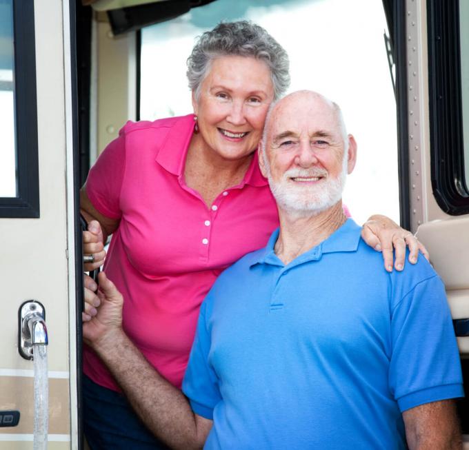 Couple posing in front of an RV